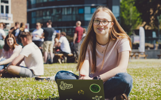 Welsh student sitting on Singleton Campus