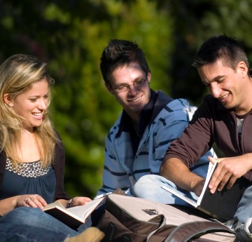 three students studying in Singleton park