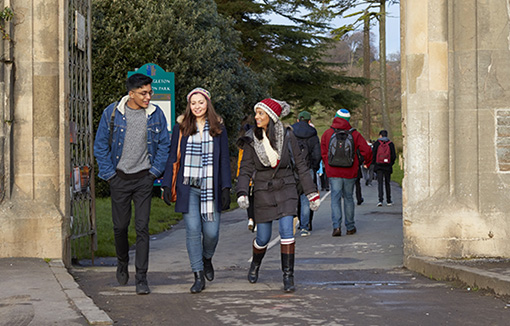 Students walking onto Singleton Campus from the park