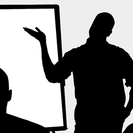 silhouette of a man making a presentation