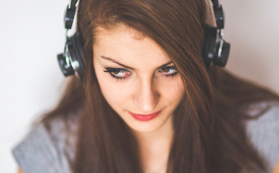 A person listening through headphones