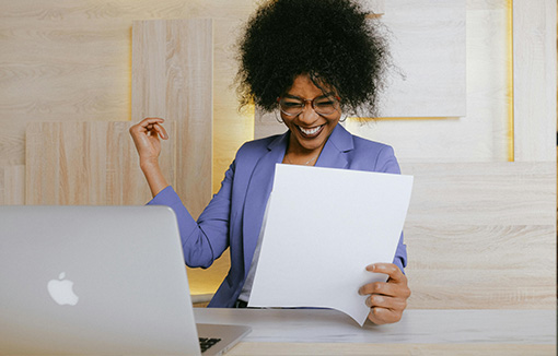 A happy student with a well presented document