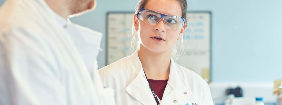 Researcher in lab with goggles
