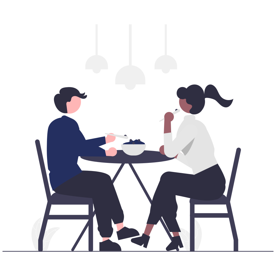 Two people eating at a table