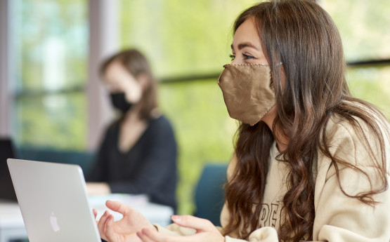 Student studying with face mask 