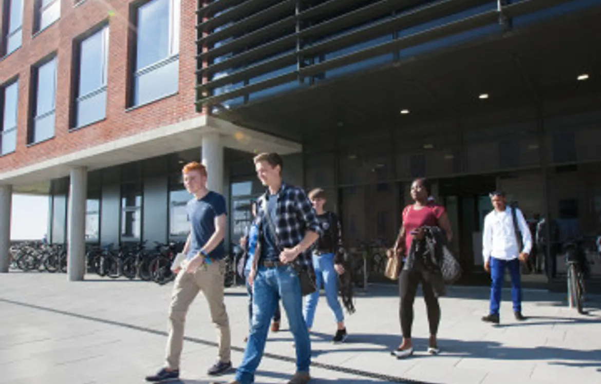 Students walking out of a building