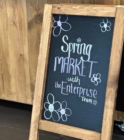 chalk sign with spring market written on