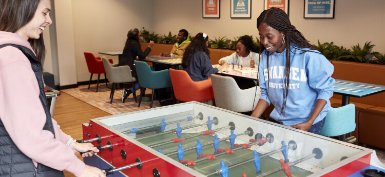 Students playing table football