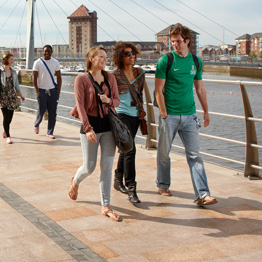 Young people walking in Swansea Marina