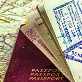 An open passport on top of a map