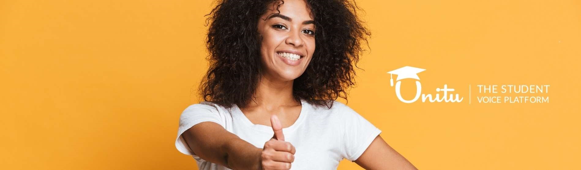 Girl with curly brown hair giving a 'thumbs up'. The background is orange and the Unitu logo is to the right of the image.